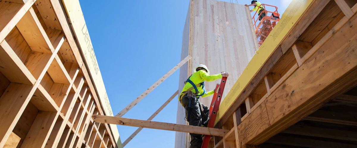Zachau Construction workers on the job site of a all wooden commercial building
