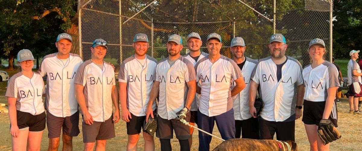 BALA Consulting Engineers wearing BALA shirts with a dog featured