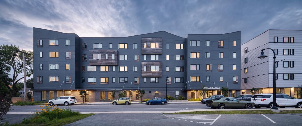 An image, taken at dusk, of the West End Apartments in South Portland, Maine. 