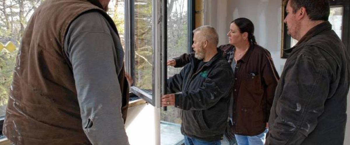 Wright Builders inspecting window