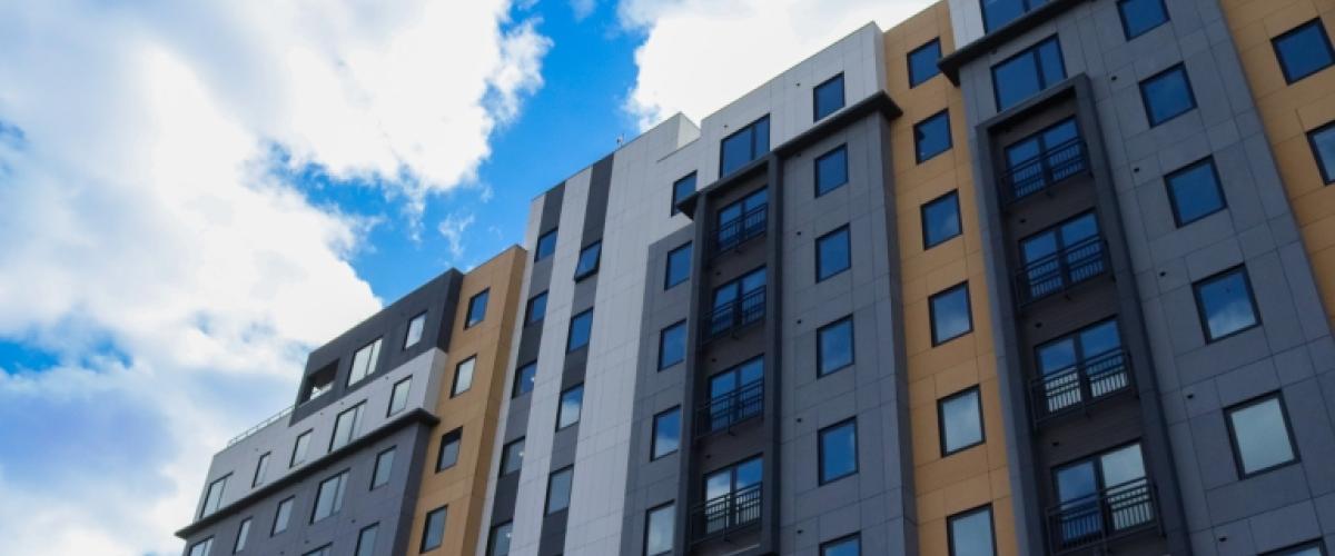 Sidewalk POV of Clarendon Hill apartments