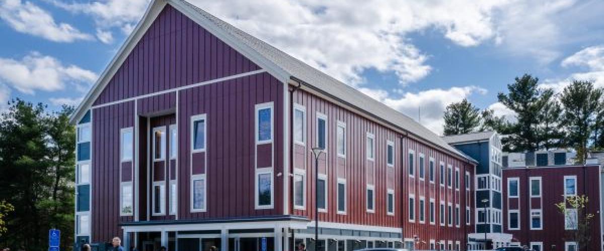 People mill about the entryway to Glen Brooks Building E.