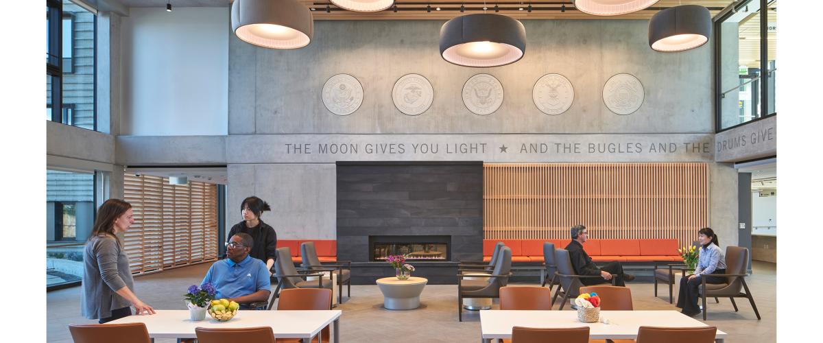 Interior lobby with seating area and communal tables