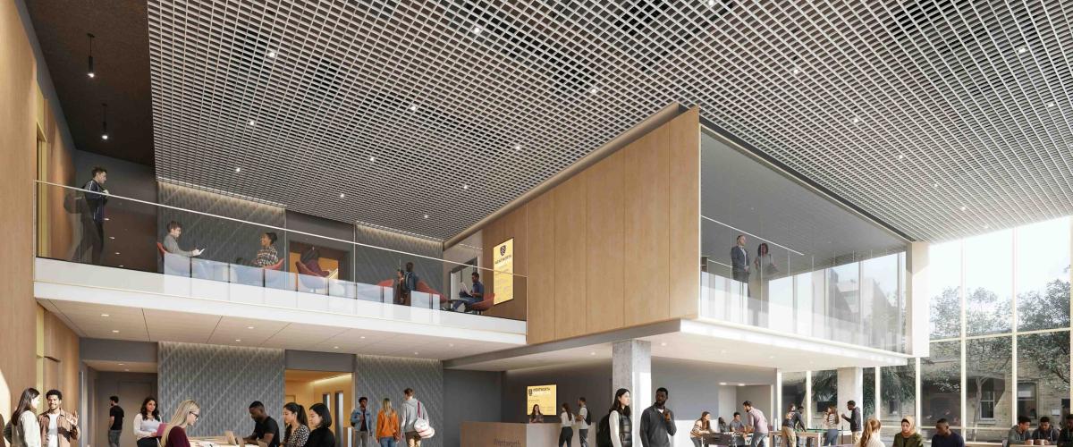 A spacious, double-height interior with a mezzanine level, characterized by a distinctive metal grid ceiling and a mix of warm wood paneling and concrete finishes.
