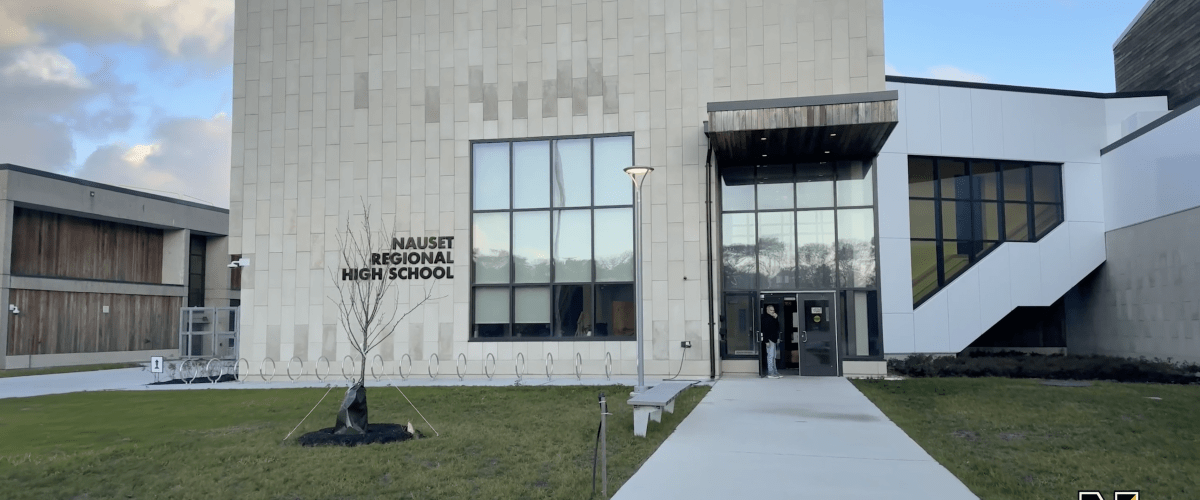 Image of exterior of new school building front entry way
