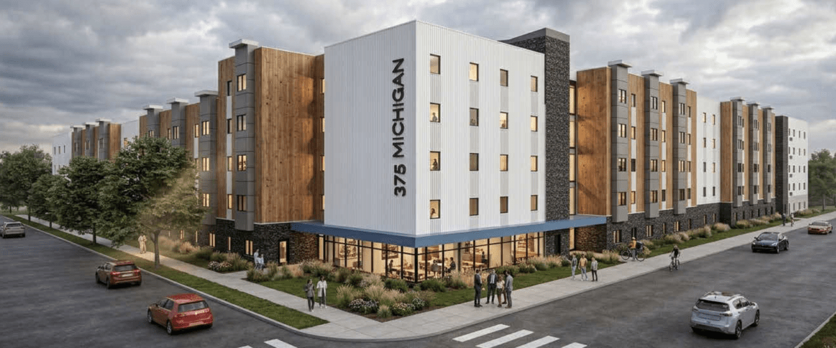 Architectural rendering of the five-story 375 Michigan Avenue affordable housing development in Buffalo, showing the main entrance, varied brick and white façades, and the building extending along the street.