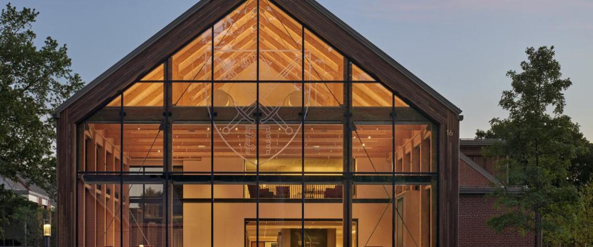 Completed admissions center at St. Paul's school at dusk.