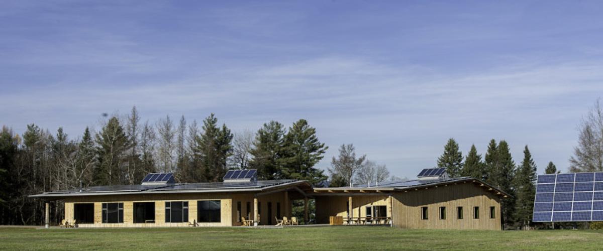 Front facing view of Craftsbury Outdoor Center – Activity Center and Lodge and solar panels