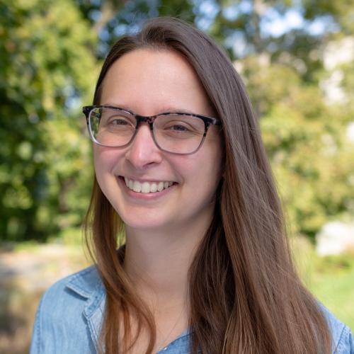 Photo of woman with long brown hair and glasses