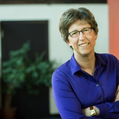 Lisa's headshot, indoor office setting