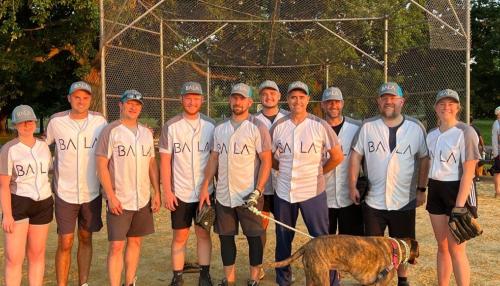 BALA Consulting Engineers wearing BALA shirts with a dog featured