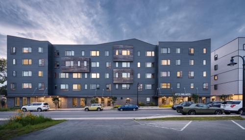 An image, taken at dusk, of the West End Apartments in South Portland, Maine. 