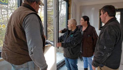 Wright Builders inspecting window