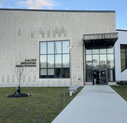 Image of exterior of new school building front entry way
