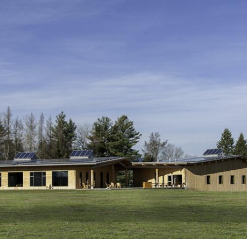 Front facing view of Craftsbury Outdoor Center – Activity Center and Lodge and solar panels